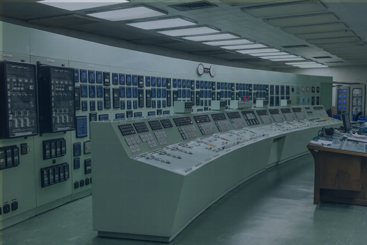 What Is Data Operations—and Why Does It Matter for Maximo? 5 Control room of a power plant with long panels of gauges and switches